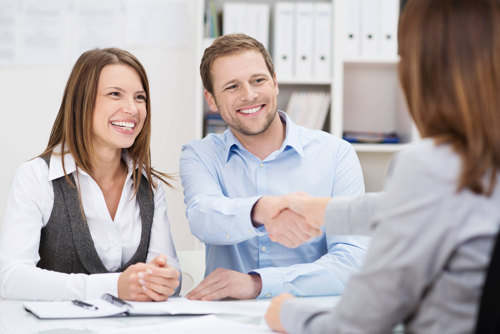 A smiling couple getting Payday Loan Debt Assistance